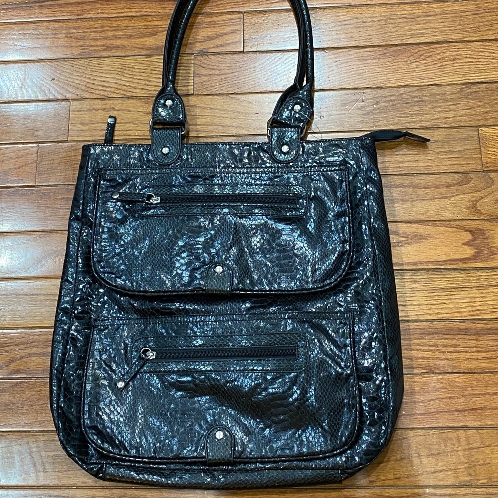 Faux snakeskin multi pocket black bag.